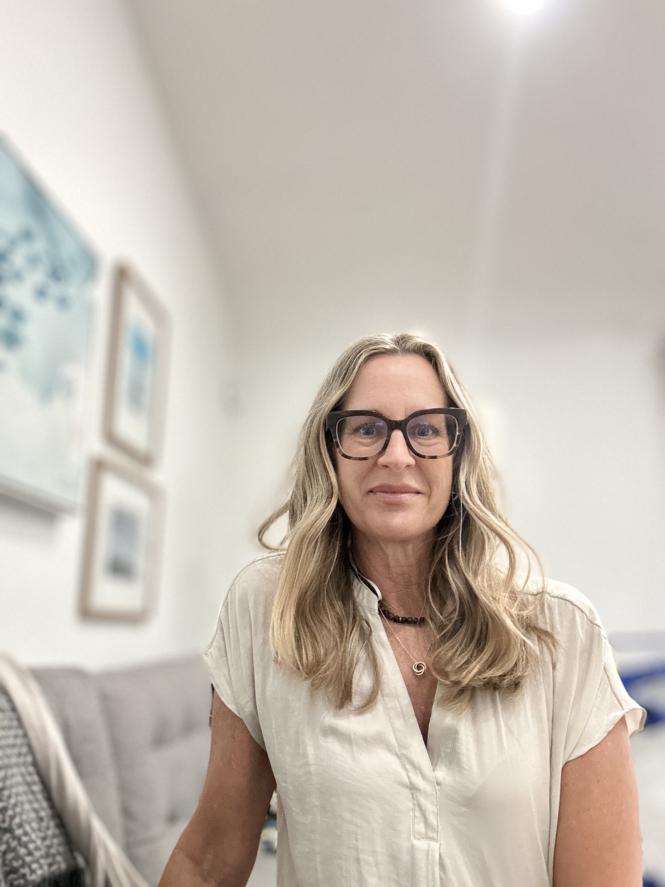 Jennifer Pankow-Martinez seated in her therapy office