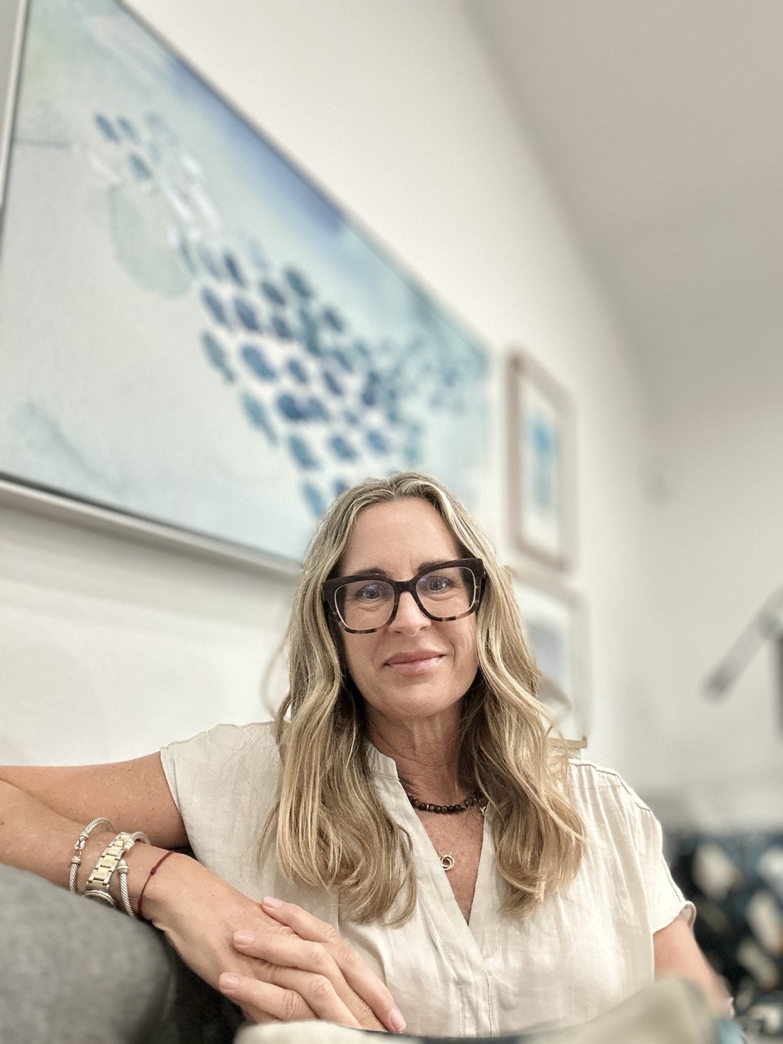 Jennifer Pankow-Martinez seated in her therapy office